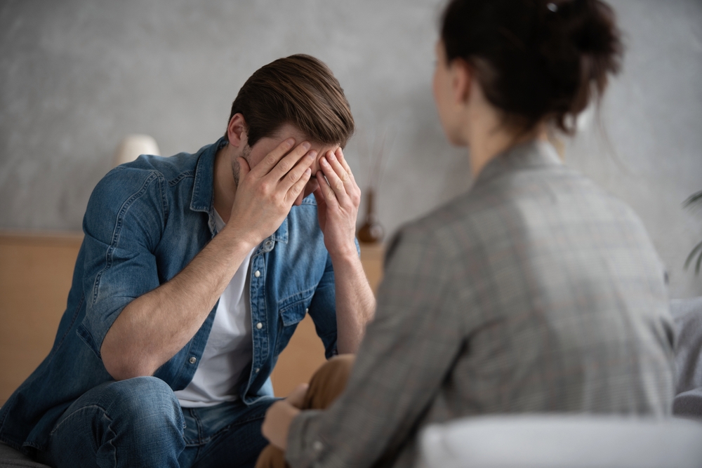 Psychologist,Talking,With,Patient,On,Therapy,Session.,Depressed,Man,Speaking